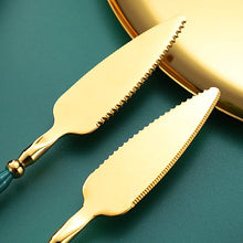 Load image into Gallery viewer, Neptune 4-piece Colored Handle Luxury Flatware Set by Allthingscurated beautifully blends mythical design with modern construction. Made from high-quality 18/10 stainless steel with a sleek mirror polishing for a modern look. Inspired by Poseidon’s Trident, the dinner fork is expertly shaped to resemble the 3-pronged spear. This place setting comes in Gold with either black, white, turquoise blue and green handle. Each set consists of a dinner spoon, dinner fork, dinner knife and a small spoon.
