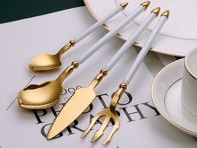 Load image into Gallery viewer, Neptune 4-piece Colored Handle Luxury Flatware Set by Allthingscurated beautifully blends mythical design with modern construction. Made from high-quality 18/10 stainless steel with a sleek mirror polishing for a modern look. Inspired by Poseidon’s Trident, the dinner fork is expertly shaped to resemble the 3-pronged spear. This place setting comes in Gold with either black, white, turquoise blue and green handle. Each set consists of a dinner spoon, dinner fork, dinner knife and a small spoon.