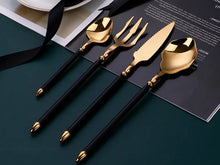 Load image into Gallery viewer, Neptune 4-piece Colored Handle Luxury Flatware Set by Allthingscurated beautifully blends mythical design with modern construction. Made from high-quality 18/10 stainless steel with a sleek mirror polishing for a modern look. Inspired by Poseidon’s Trident, the dinner fork is expertly shaped to resemble the 3-pronged spear. This place setting comes in Gold with either black, white, turquoise blue and green handle. Each set consists of a dinner spoon, dinner fork, dinner knife and a small spoon.