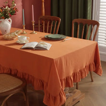 Load image into Gallery viewer, Introducing Ruffled Cotton Tablecloth by Allthingscurated. Made from 100% cotton, our tablecloth exudes French country charm with its romantic, frilly ruffles. With the perfect balance of decorative and laid-back, they have a welcoming and comforting vibe. Available in 8 solid colors.
