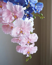 Load image into Gallery viewer, Silk Phalaenopsis Orchids by Allthingscurated feature dynamic blooms with vivid details and texture that will add a touch of understated elegance and charm to your living space. These graceful beauties come in 5 mesmerizing colors.