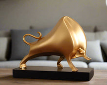 Load image into Gallery viewer, The Oscar Bull Sculpture by Allthingscurated spots an abstract and contemporary design in a matte gold finish. This stunning piece makes the perfect gift for those born under the zodiac ox sign and Taurus. It not only serves as a beautiful display but also adds a touch of personality.