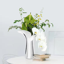 Load image into Gallery viewer, Manhattan Stainless Steel Petal Vase by Allthingscurated combines modern sophistication with minimal elegance. Designed with a petal-shaped rim that opens up up like a blooming flower, it’s a fun yet refined statement piece for any home décor style. Makes a stylish gift for housewarmings. Available in 2 sizes.