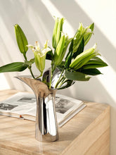 Load image into Gallery viewer, Manhattan Stainless Steel Petal Vase by Allthingscurated combines modern sophistication with minimal elegance. Designed with a petal-shaped rim that opens up up like a blooming flower, it’s a fun yet refined statement piece for any home décor style. Makes a stylish gift for housewarmings. Available in 2 sizes.
