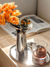 Load image into Gallery viewer, Manhattan Stainless Steel Petal Vase by Allthingscurated combines modern sophistication with minimal elegance. Designed with a petal-shaped rim that opens up up like a blooming flower, it’s a fun yet refined statement piece for any home décor style. Makes a stylish gift for housewarmings. Available in 2 sizes.