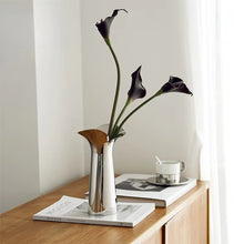Load image into Gallery viewer, Manhattan Stainless Steel Petal Vase by Allthingscurated combines modern sophistication with minimal elegance. Designed with a petal-shaped rim that opens up up like a blooming flower, it’s a fun yet refined statement piece for any home décor style. Makes a stylish gift for housewarmings. Available in 2 sizes.