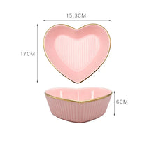 Load image into Gallery viewer, Pink heart-shaped ceramic dish with dimensions on a white background. Gold-rimmed Heart Shape Ceramic Bowl by Allthingscurated is a beautiful and versatile piece to own in your dinnerware collection. Perfect for salads, desserts and appetizers, its charming design adds an extra touch of romance for Valentine’s Day dinner; and make everyday meals extra special.