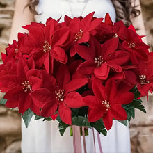 Load image into Gallery viewer, Bouquet of red poinsettias with a blurred background. Bring the true spirit of the holidays into your home with this bundle of 5 classic red Faux Poinsettia by Allthingscurated. These timeless blooms complement any festive palette and instantly evokes Christmas cheer.