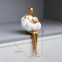 Load image into Gallery viewer, Sophie Cloud Girl Sculptures by Allthingscurated feature 2 beautiful lady statues in 2 postures—reading and pondering. Adorned with a classic ballerina bun and dressed in a minimalistic dress that ends with a voluminous skirt reminiscent of fluffy clouds. These sculptures bring a touch of serenity and sophistication to your living space. Featured here is the lady pondering with a faux crystal ball in hands.