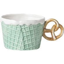 Load image into Gallery viewer, The Waffle Cup and Plate collection by Allthingscurated features a charming waffle pattern and whimsical biscuit design that will bring a smile to your breakfast. Each piece is hand painted on porcelain. Perfect for breakfast and tea time. Makes a great gift for any occasion. Cup and plate each comes in 4 designs to choose from. Featured here is cup with pretzel handle in blue.