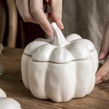 Load image into Gallery viewer, Lidded Stoneware Pumpkin Bowl by Allthingscurated features a sculptural pumpkin design.  It has a matte glaze finish in creamy white. Holds a capacity of 450mil or 15 ounce. Oozing with autumnal charm, it's the perfect serving bowl for all your thanksgiving, halloween and fall feasts.