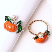 Load image into Gallery viewer, Faux Pearl Pumpkin Rings by Allthingscurated come in a set of 6 napkin rings. Each ring is crafted with exquisite detail of a pumpkin design and adorned with a faux pearl to bring a touch of sophistication. Perfect for all fall festivities, from Halloween to Thanksgiving.
