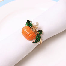 Load image into Gallery viewer, Faux Pearl Pumpkin Rings by Allthingscurated come in a set of 6 napkin rings. Each ring is crafted with exquisite detail of a pumpkin design and adorned with a faux pearl to bring a touch of sophistication. Perfect for all fall festivities, from Halloween to Thanksgiving.