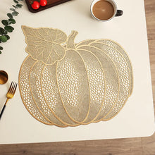 Load image into Gallery viewer, Pumpkin Vinyl Placemats by Allthingscurated are designed with perforated hollow patterns to create a unique texture and add dimension to your table setting. Made from durable PVC vinyl, they are stain-resistant and easy to maintain. Perfect for Thanksgiving and Halloween celebrations.