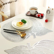 Load image into Gallery viewer, Pumpkin Vinyl Placemats by Allthingscurated are designed with perforated hollow patterns to create a unique texture and add dimension to your table setting. Made from durable PVC vinyl, they are stain-resistant and easy to maintain. Perfect for Thanksgiving and Halloween celebrations.
