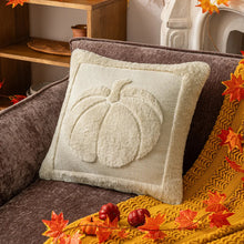 Load image into Gallery viewer, Decorative pillow with pumpkin design on a brown couch with autumn leaves. Cozy living room with a sofa adorned with pumpkin-themed pillows and a yellow blanket. The Velour Pumpkin Cushion Cover by Allthingscurated is a beautiful way to bring the warmth of fall into your home. With its elegant tufted pumpkin design and soft velour fabric, it offers both comfort and style. Perfect for autumn and Thanksgiving, this decorative pillow adds a cozy, inviting touch to any space.