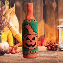 Load image into Gallery viewer, Halloween Knitted Wine Bottle Sleeves by Allthingscurated come in 3 trendy design of a skull, spider and pumpkin. They are are great way to dress up your wine bottles for quick Halloween makeover for your home and dining table. Featured here is the pumpkin design.