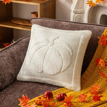 Load image into Gallery viewer, White pillow with pumpkin design on a brown couch with autumn decorations. Cozy living room with a sofa adorned with pumpkin-themed pillows and a yellow blanket. The Velour Pumpkin Cushion Cover by Allthingscurated is a beautiful way to bring the warmth of fall into your home. With its elegant tufted pumpkin design and soft velour fabric, it offers both comfort and style. Perfect for autumn and Thanksgiving, this decorative pillow adds a cozy, inviting touch to any space.