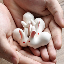 Load image into Gallery viewer, Enhance your Asian dining experience with our Ceramic Rabbit Chopstick Rests by Allthingscurated. These pieces will bring a playful edge to your table with their ability to keep your chopsticks clean and secure. Comes in a set of 3 or 6 pieces.
