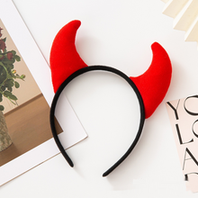Load image into Gallery viewer, Horn Shape Headband by Allthingscurated features trendy, three-dimensional horns that is fun and perfect for elevating your Halloween party look. This accessory is perfect for adding a playful touch to your costume and make a statement at any Halloween party. Comes in 3 colors. Featured here is the Red Back headband.