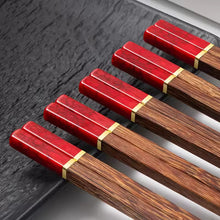 Load image into Gallery viewer, Faux Jade Wooden Chopsticks by Allthingscurated feature five striking colors with jade embellishment crafted from high-grade resin that is contemporary in design yet practical in everyday dining or special occasions. Come as a set of 5 pairs or 10 pairs. Shown here is a set in Red.