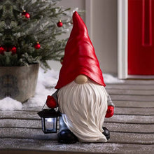 Load image into Gallery viewer, Christmas Red Gnome by Allthingscurated featuring a vibrant red pointy hat and a lantern in hand, is a charming décor idea for your Christmas holiday! It’s a delightful decorative ornament for your mantle or a stunning centerpiece for your Christmas table. Perfect for indoor charm or making a statement in your garden.