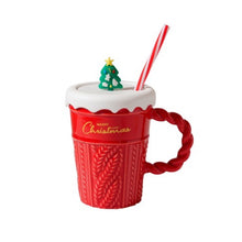 Load image into Gallery viewer, Snow Capped Christmas Gift Mug by Allthingscurated boasts festive colors of red, green and white, featuring a Merry Christmas greeting engraved on the mug. The elegant mug is crafted from ceramic with a snow-like lid and a charming Christmas relief pattern, making it the perfect gift for your friends and colleagues during office parties. Comes with a straw for added convenience. Featured here is the mug in Red with red handle and Christmas Tree on Snow Capped Lid and Red and white straw.