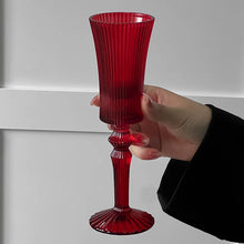 Load image into Gallery viewer, Cecily Flute Glasses by Allthingscurated feature a medieval-inspired vertical ridged design that provides a unique texture with an elegant touch. The long, sturdy stem ensures a steady hold while the jewel tones add a touch of sophistication to any celebration. Designed to complement your favorite wines, these glasses are perfect for entertaining and will brighten up any table.