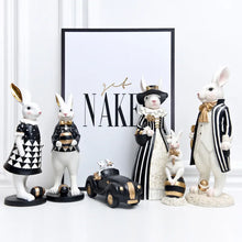 Load image into Gallery viewer, Our Regal Rabbit Family Figurines by Allthingscurated are beautifully-crafted and decorative. Made high-quality resin, these unique figurines will add a touch of elegance and whimsy to your home décor. Available in 6 designs, they are the perfect additions to your spring and Easter decorations.