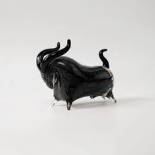 Load image into Gallery viewer, Rex Decorative Bull by Allthingscurated are meticulously handmade from high quality glass. Comes in three striking finishes—an all-all black edition or two-tone variants featuring bold graphic elements. Rex brings contemporary flair and bold energy to any room. More than décor, it’s an ideal gift for those born under the Ox zodiac and Taurus sign. Shown here is the all black bull.