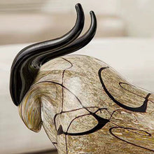 Load image into Gallery viewer, Decorative bull sculptures on books with a candle against a textured white wall. Rex Decorative Bull by Allthingscurated are meticulously handmade from high quality glass. Comes in three striking finishes—an all-all black edition or two-tone variants featuring bold graphic elements. Rex brings contemporary flair and bold energy to any room. More than décor, it’s an ideal gift for those born under the Ox zodiac and Taurus sign. Here shows the close up shot of the bull head with black horns.