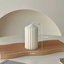 Load image into Gallery viewer, White Ribbed Column Candles by Allthingscurated are made of 100% soy wax. Hand crafted with vertical ridged pattern for texture, these candles are scented with the sweet smell of white rose. Available in 2 sizes. Featured here is the short candle.