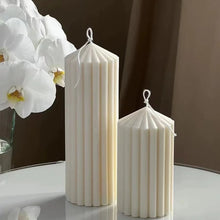 Load image into Gallery viewer, White Ribbed Column Candles by Allthingscurated are made of 100% soy wax. Hand crafted with vertical ridged pattern for texture, these candles are scented with the sweet smell of white rose. Available in 2 sizes.