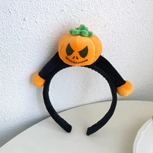 Load image into Gallery viewer, Featuring 3 cute designs, Plush Halloween Headbands by Allthingscurated blend comfort with style. They add a charming touch to your costume and create joyful photo moments to capture the festive spirit.
Seen here is the orange Pumpkin design headband with a black face on a white surface.