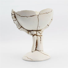 Load image into Gallery viewer, Gothic Skeleton Hand Storage Bowl by Allthingscurated boasts a spooky design featuring a ghoulish skeleton claw in neutral warm off-white and vivid hand bones encircling the bowl. Perfect for adding a frightful touch to your Halloween decor. Crafted from resin and measuring height of 13.5m or5.3 inches and width of 12cm or 4.7 inches.