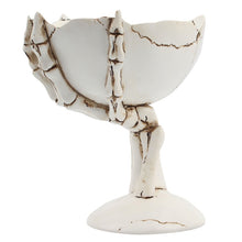 Load image into Gallery viewer, Gothic Skeleton Hand Storage Bowl by Allthingscurated boasts a spooky design featuring a ghoulish skeleton claw in neutral warm off-white and vivid hand bones encircling the bowl. Perfect for adding a frightful touch to your Halloween decor. Crafted from resin and measuring height of 13.5m or5.3 inches and width of 12cm or 4.7 inches.