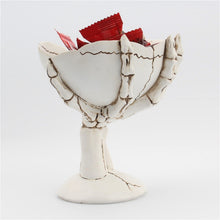 Load image into Gallery viewer, Gothic Skeleton Hand Storage Bowl by Allthingscurated boasts a spooky design featuring a ghoulish skeleton claw in neutral warm off-white and vivid hand bones encircling the bowl. Perfect for adding a frightful touch to your Halloween decor. Crafted from resin and measuring height of 13.5m or5.3 inches and width of 12cm or 4.7 inches.
