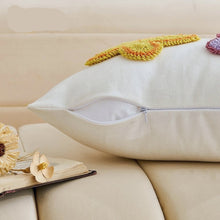 Load image into Gallery viewer, A close up of an half-zipped decorative pillow on a beige sofa. Spring Melody Embroidered Cushion Covers by Allthingscurated feature charming seasonal details to transition your home into Spring and Easter effortlessly. Each cover showcases meticulous embroidery to add depth and visual interest to your sofa and furniture.