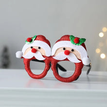 Load image into Gallery viewer, These Christmas Party Glasses by Allthingscurated are the perfect fun accessory for festive parties and gatherings during the holiday season. Their unique design and cheerful holiday style make them great props for creating memorable moments an happy Instagram posts to capture the joy of the season. Featured here is Santa design.