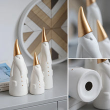 Load image into Gallery viewer, Not your typical jolly Santa Clauses with a plush red suit and rounded belly, this Nordic Santa Claus Figurines Set by Allthingscurated featured 3 porcelain figures of Santa Claus dressed in long white gown and a gold pointed hat. With subtle, understated elegance, they are perfect decoration to add to your Christmas collection to create an enchanting display. Figurines come in 3 different heights of 15cm, 20cm and 23cm or 6 inches, 7.8 inches and 9 inches.
