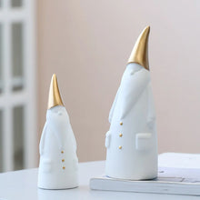 Load image into Gallery viewer, Not your typical jolly Santa Clauses with a plush red suit and rounded belly, this Nordic Santa Claus Figurines Set by Allthingscurated featured 3 porcelain figures of Santa Claus dressed in long white gown and a gold pointed hat. With subtle, understated elegance, they are perfect decoration to add to your Christmas collection to create an enchanting display. Figurines come in 3 different heights of 15cm, 20cm and 23cm or 6 inches, 7.8 inches and 9 inches.