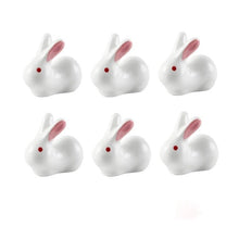 Load image into Gallery viewer, Enhance your Asian dining experience with our Ceramic Rabbit Chopstick Rests by Allthingscurated. These pieces will bring a playful edge to your table with their ability to keep your chopsticks clean and secure. This is a set of 6 pieces.