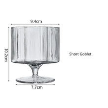 Load image into Gallery viewer, Florentina Drinkware by Allthingscurated embraces a modern design featuring sleek fluted lines with a unique shape reminiscent of a peach blossom flower. Stylish and chic, this collection includes a carafe, goblets and several tumblers, including a glamorous coupe cocktail glass. Add elegance to everyday use with this beautiful collection and just as perfect for setting an extravagant holiday table. Seen here is a Short Goblet.