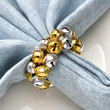 Load image into Gallery viewer, Jingle Bells Napkin Rings by Allthingscurated. Come as a set of 6 rings in color combos of red and green, or silver and gold, they are the perfect finishing touch for your holiday table setting. Spread the joy of Christmas and charm your guests with the cheerful bells.