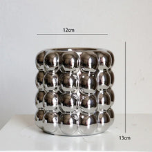 Load image into Gallery viewer, Zayla Bubble Planters by Allthingscurated are made from ceramic. These planters feature a chic design with striking 3D bubble exterior that looks sophisticated and will transform the look of your beloved indoor plants effortlessly. Come in 2 sizes and available in 3 colors that will complement any modern home décor styles. Featured here is the small silver planter.