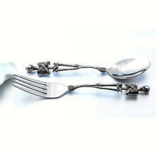 Load image into Gallery viewer, Skeleton Fork and Spoon by Allthingscurated offer a frightful but fun experience in your next dinner party. Crafted from stainless steel.