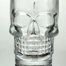 Load image into Gallery viewer, Skull Beer Mug by Allthingscurated blends functionality with style. Made with thickened glass with a heavy bottom for stability, it spots a fun, cool skull shape design that is ideal for Halloween or everyday use. The large capacity is perfect for beer or any beverage. Add this must-have mug to your drinkware collection and be ready for any gatherings or house parties.