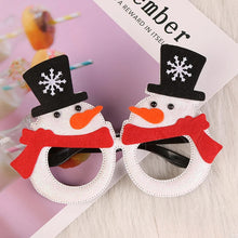 Load image into Gallery viewer, These Christmas Party Glasses by Allthingscurated are the perfect fun accessory for festive parties and gatherings during the holiday season. Their unique design and cheerful holiday style make them great props for creating memorable moments an happy Instagram posts to capture the joy of the season. Featured here is Snowman design.