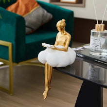 Load image into Gallery viewer, Sophie Cloud Girl Sculptures by Allthingscurated feature 2 beautiful lady statues in 2 postures—reading and pondering. Adorned with a classic ballerina bun and dressed in a minimalistic dress that ends with a voluminous skirt reminiscent of fluffy clouds. These sculptures bring a touch of serenity and sophistication to your living space.