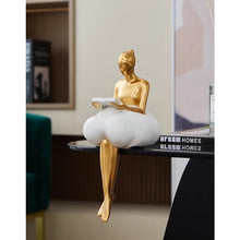 Load image into Gallery viewer, Sophie Cloud Girl Sculptures by Allthingscurated feature 2 beautiful lady statues in 2 postures—reading and pondering. Adorned with a classic ballerina bun and dressed in a minimalistic dress that ends with a voluminous skirt reminiscent of fluffy clouds. These sculptures bring a touch of serenity and sophistication to your living space.